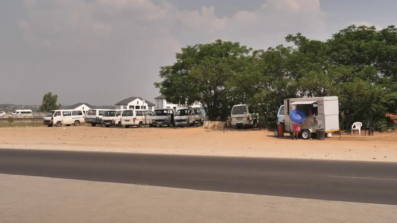 Informal Taxi stop next to road in South Africa with food vendor in trailer