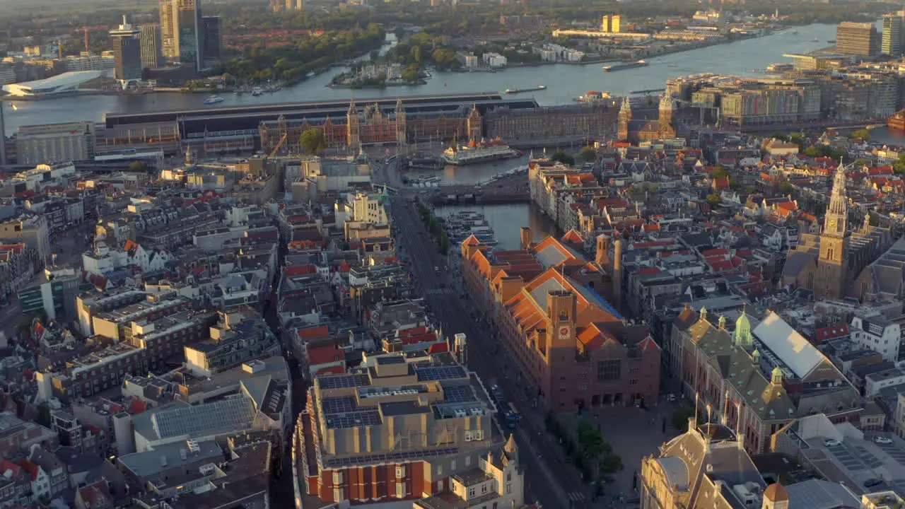 Circling drone shot over Damrak Amsterdam Central station