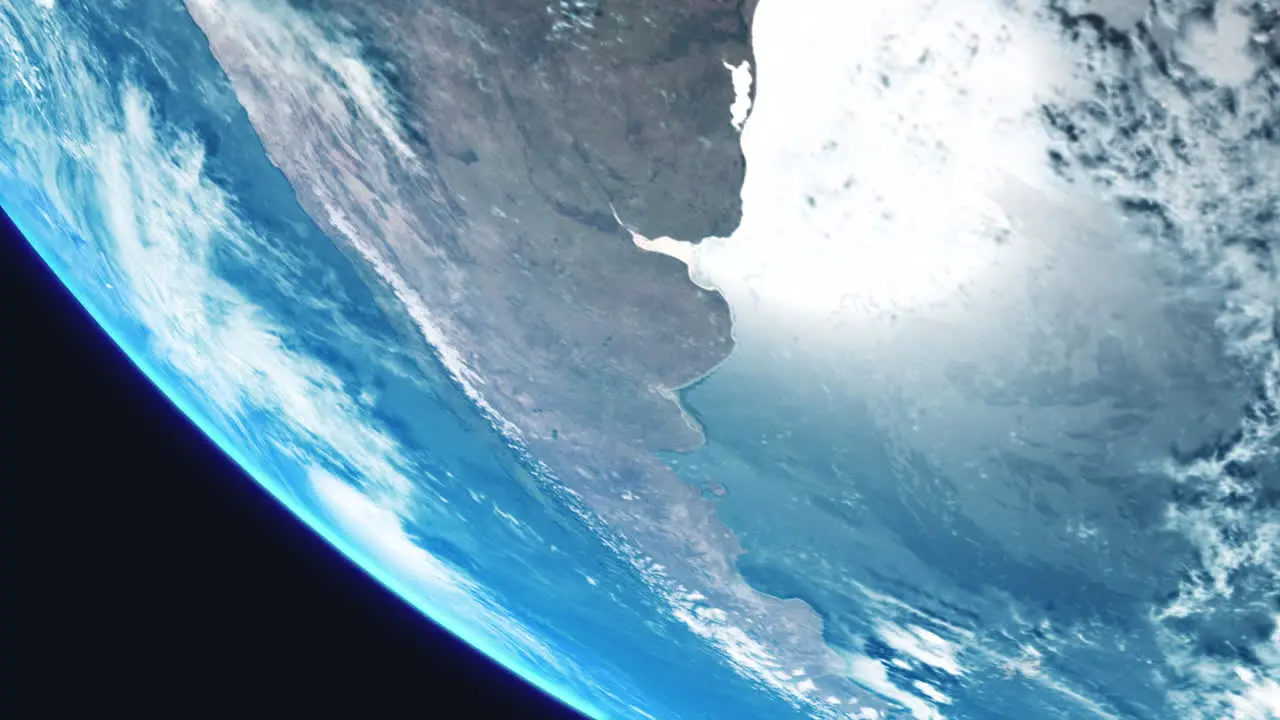 Argentina South America from Space with Earth Slowly Rotating with View from Orbit with Dynamic Clouds Sea Atmosphere and Strong Sun Reflection on Ocean Sea