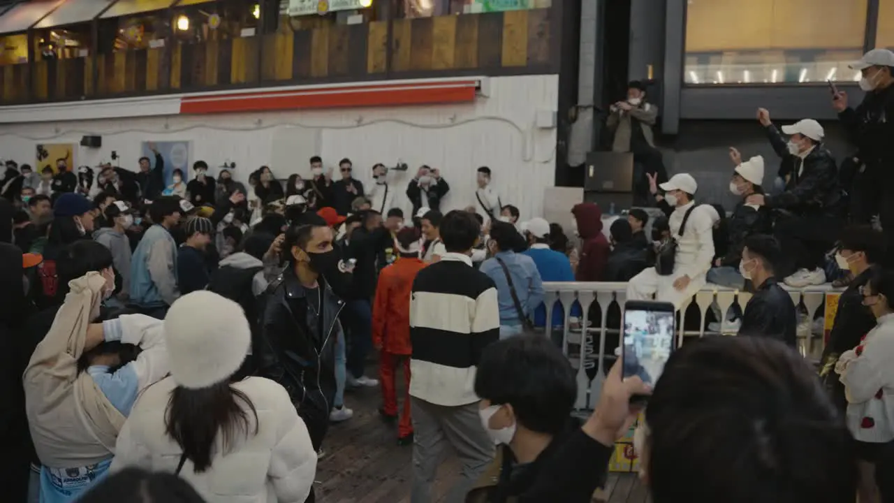 Young Japanese Dance and Party in the Streets of Dotonbori in Celebration