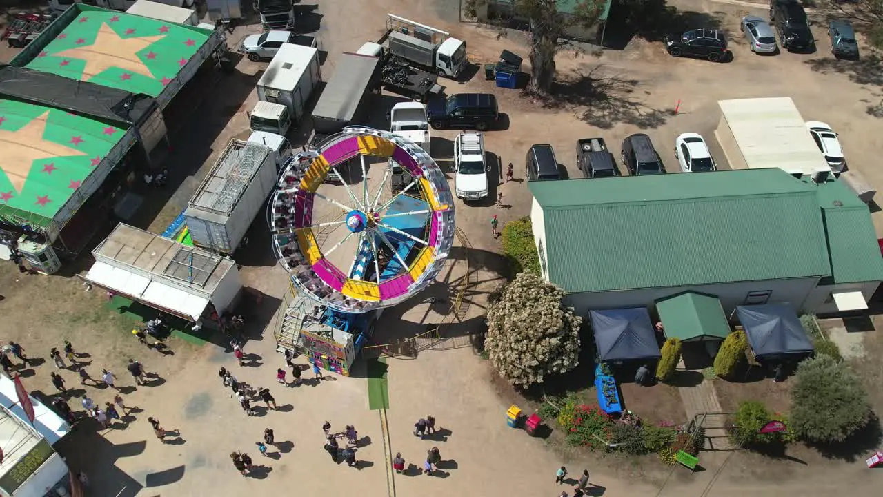 Yarrawonga Victoria Australia 7 October 2023 Close aerial view of the Tornado amusement ride tilting and spinning at the Yarrawonga Show