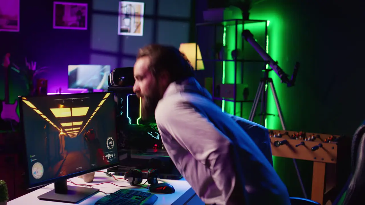 Man starting gaming session using powerful computer to play game