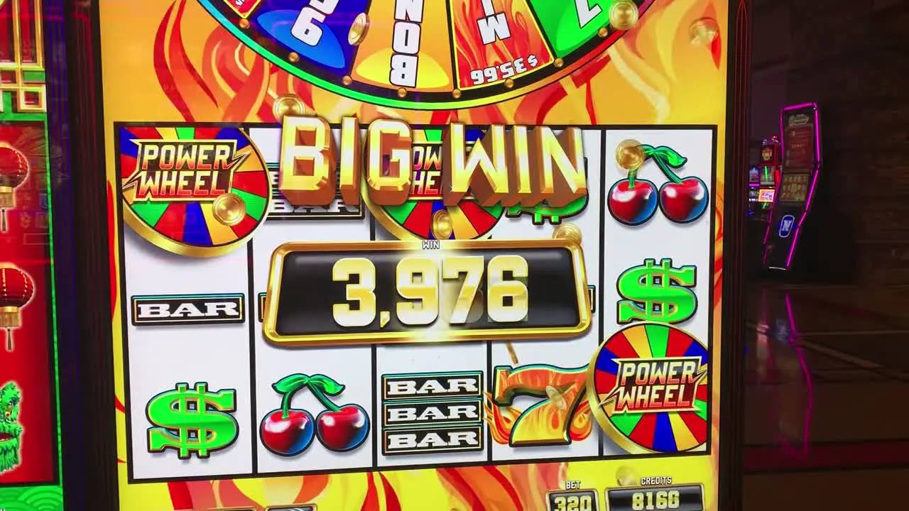 A NEW "Heat 'Em Up Power Wheel" slot machine with Bonus Features hitting a "BIG WIN