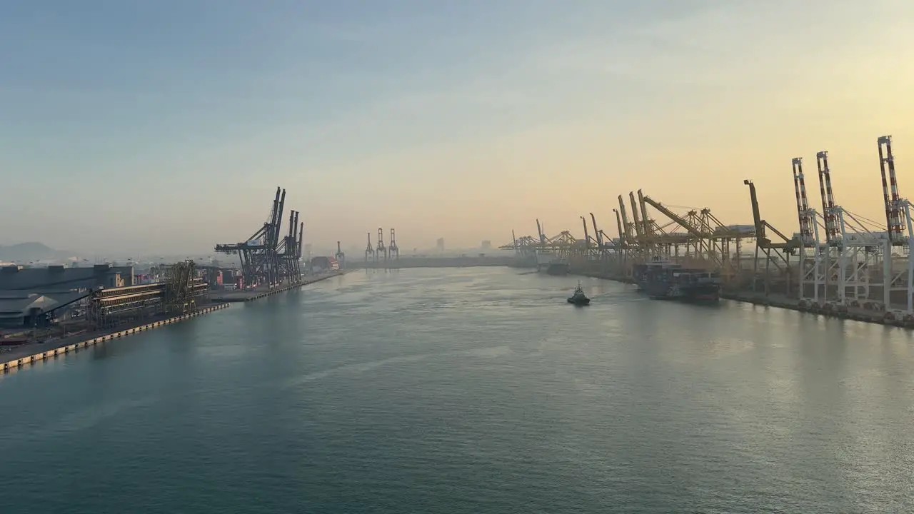 Point of view of the seascape and Laem Chabang Port against the background of a soft glow sunrise in Thailand