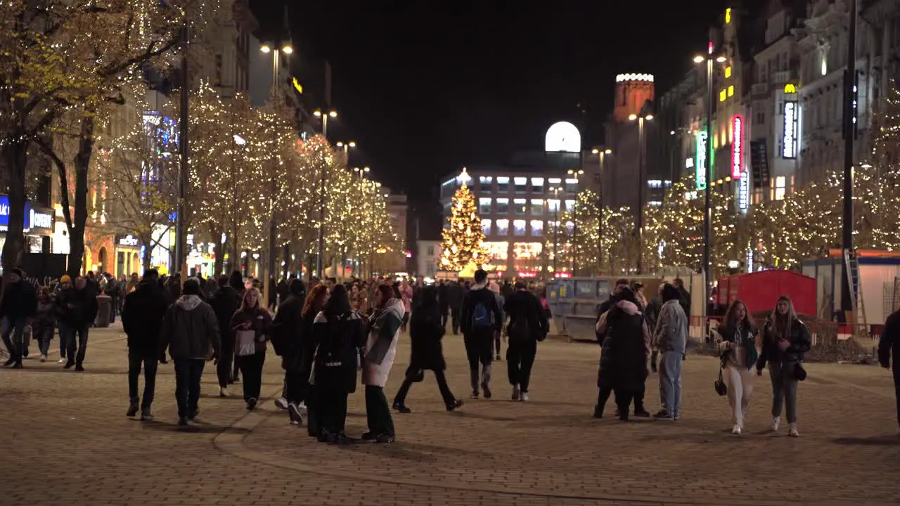 Tram passing on Christmas decorated Wenceslas square at night Prague