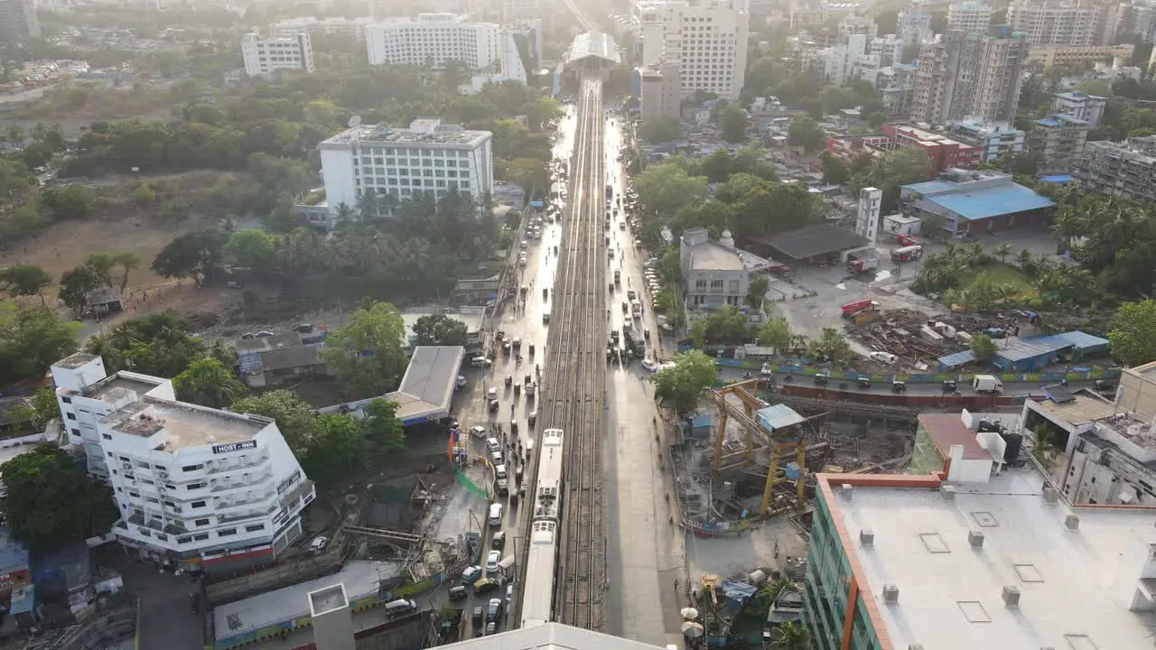 drone shot birds-eye view and her marol metro station Mumbai international airport mumbai india wide-angle train starting from Andheri station to moroli station