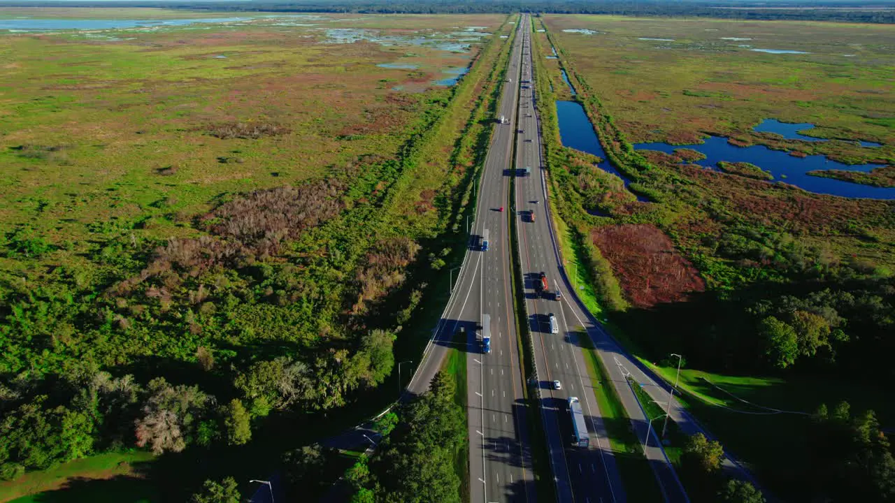 Concept aerial of trucking logistics business Following shot as truck drives on the highway