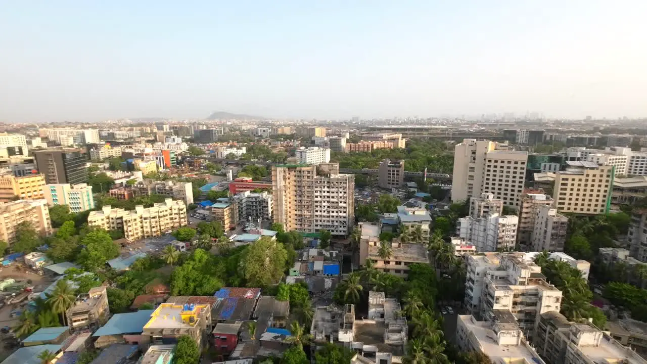 drone shot birds-eye view Andheri marol metro station Mumbai international airport Mumbai India wide-angle train side view