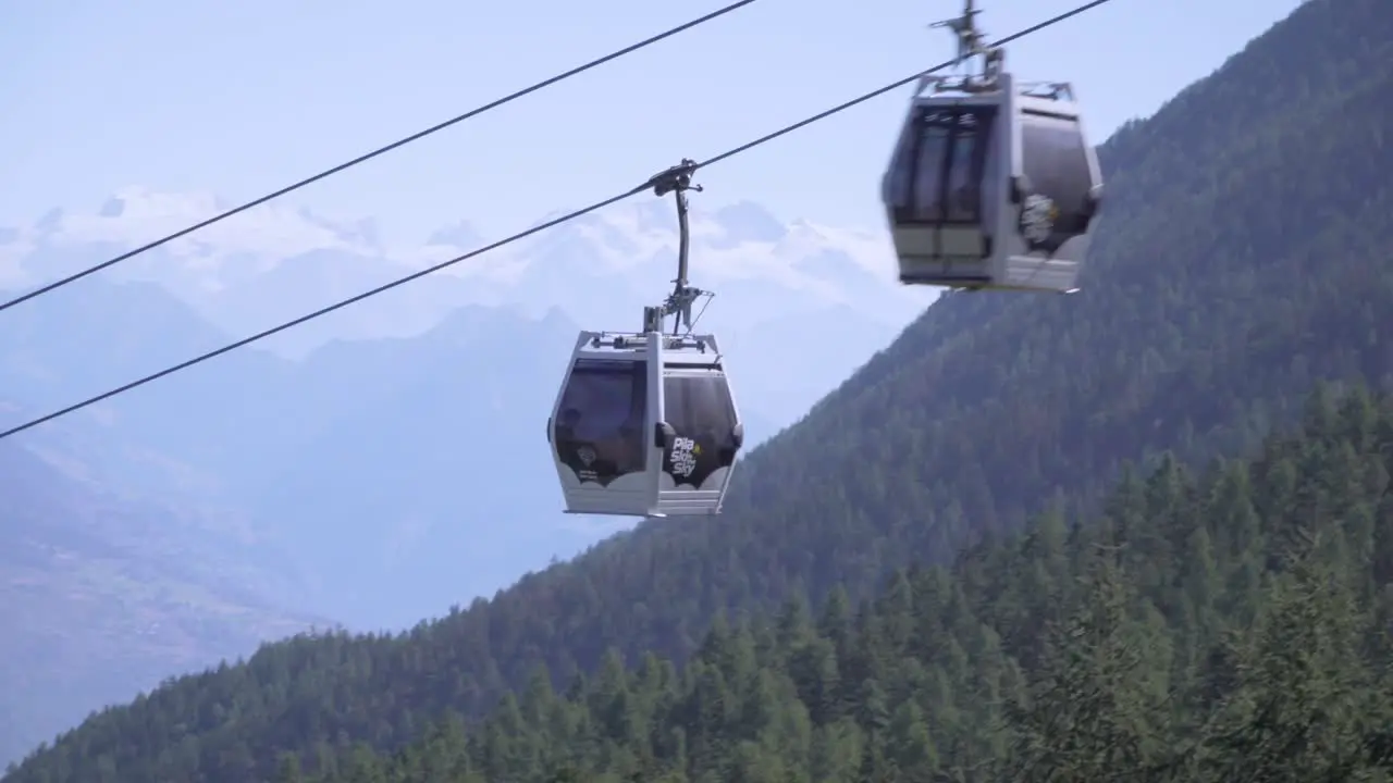 Cableway cabin going up on italian alps mountains on the background