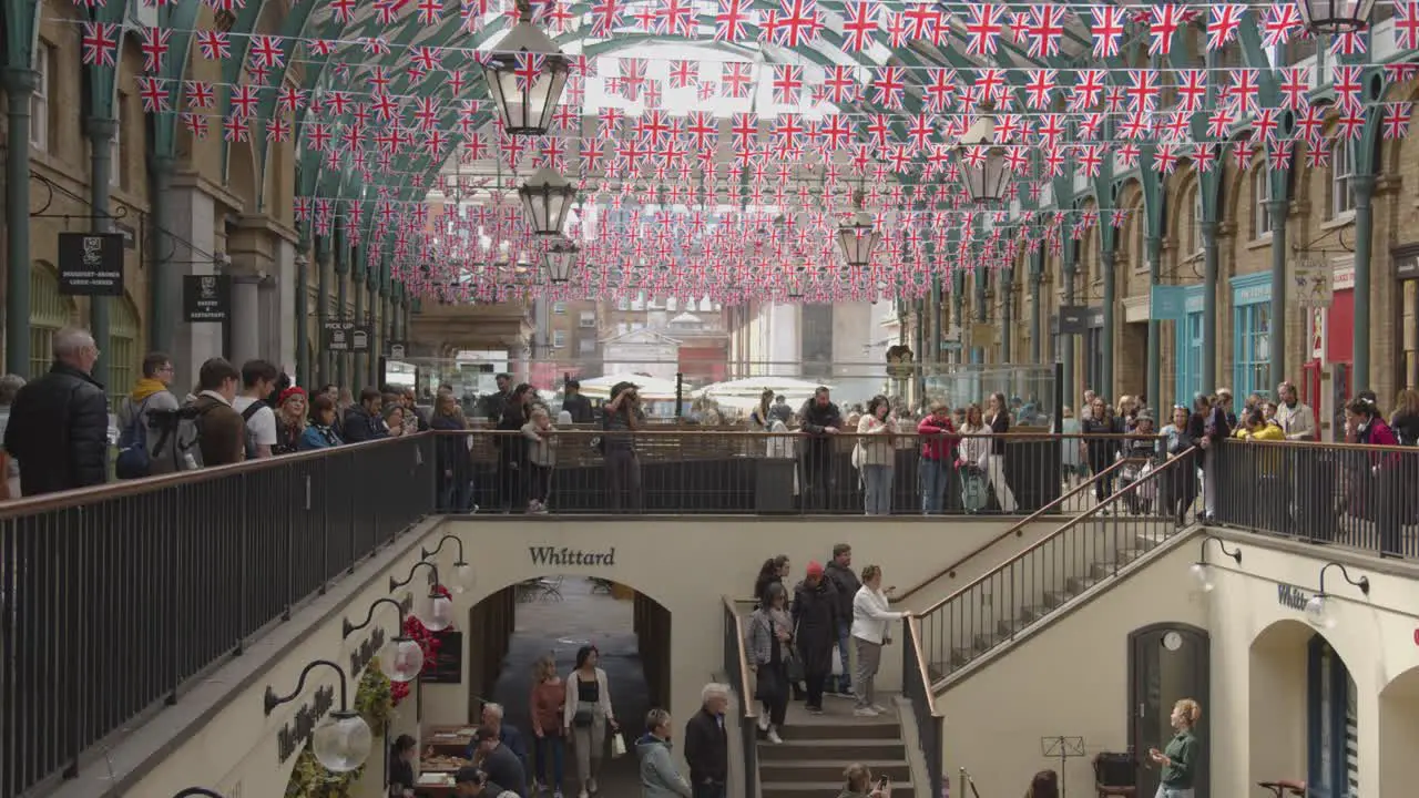 Street Performer In Covent Garden Market With Tourists In London UK 4