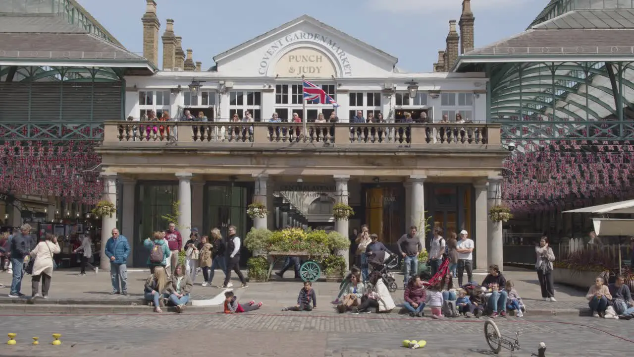 Street Performer In Covent Garden Market With Tourists In London UK 3