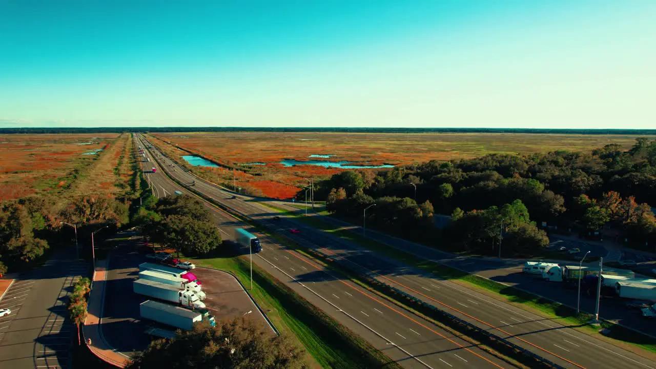 Concept aerial footage of trucking logistics business on a highway