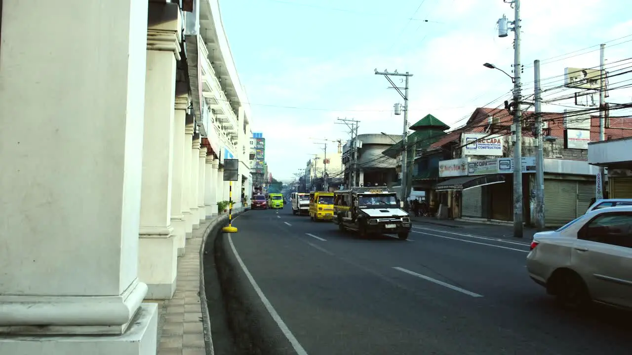 Green Jeepney and other vehicles on the run in Davao City the Philippines