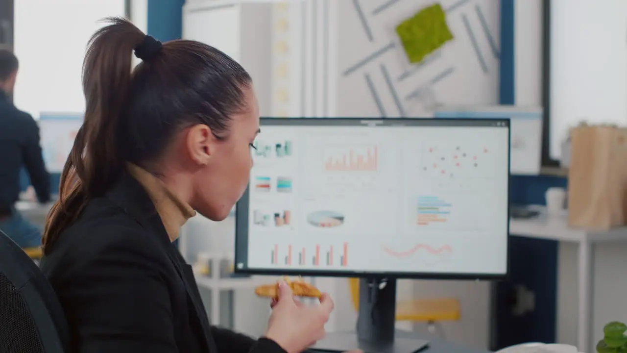 Closeup of entrepreneur woman having takeaway fastfood order during lunchtime