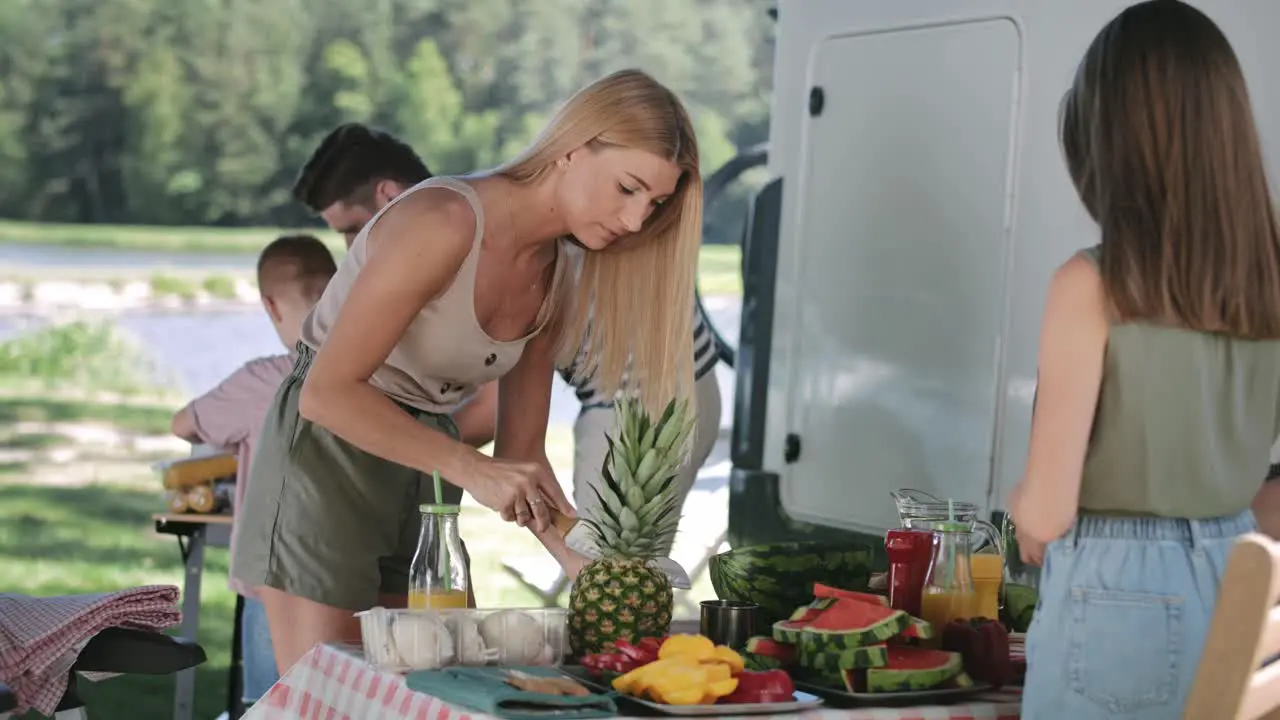 Handheld video of mother and daughter preparing food for picnic