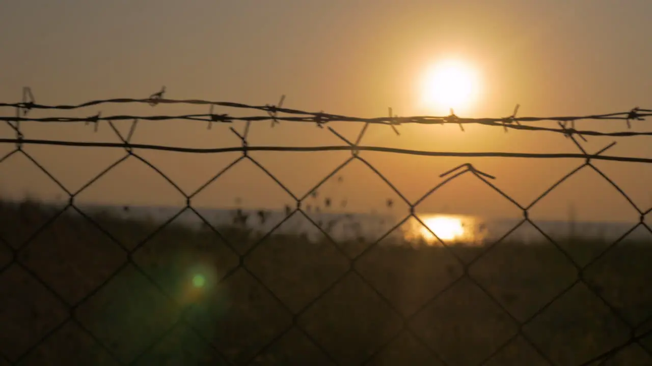 Through the barbed wire seen sea