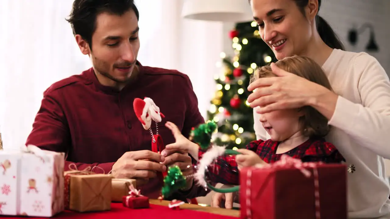 Family with baby celebrating Christmas together