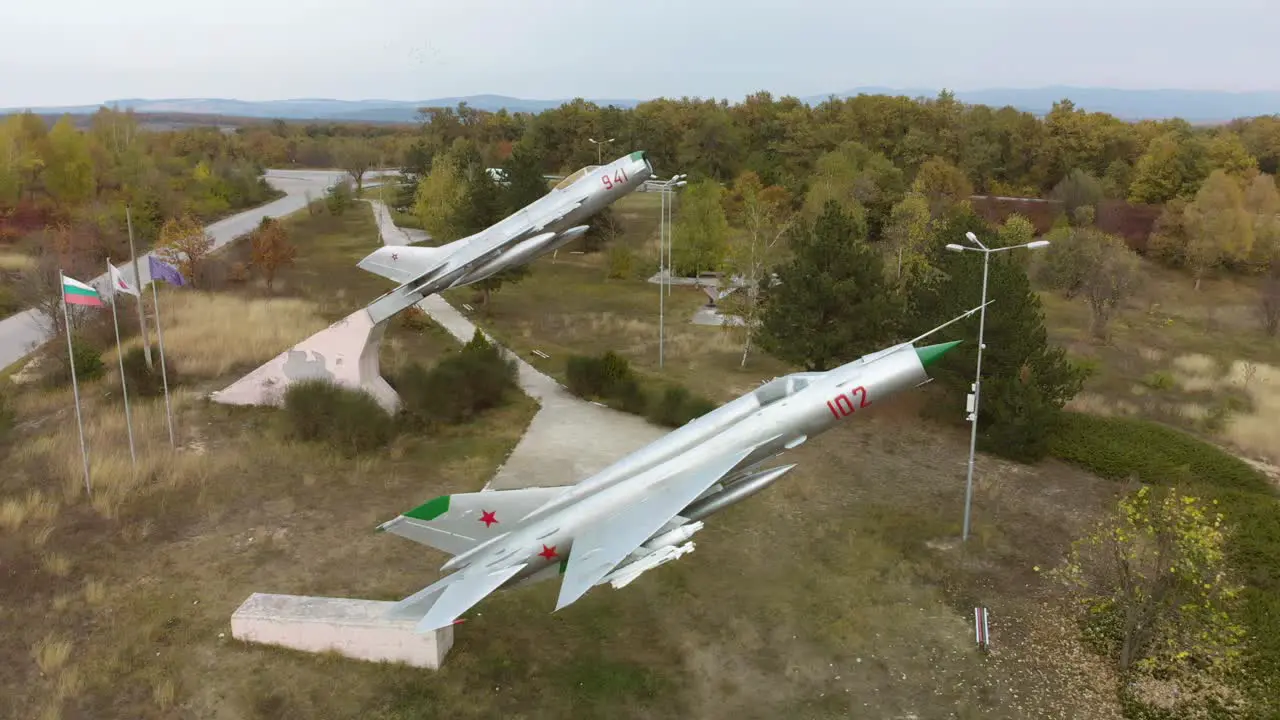 Aerial footage of military airplanes outdoor museum exhibition