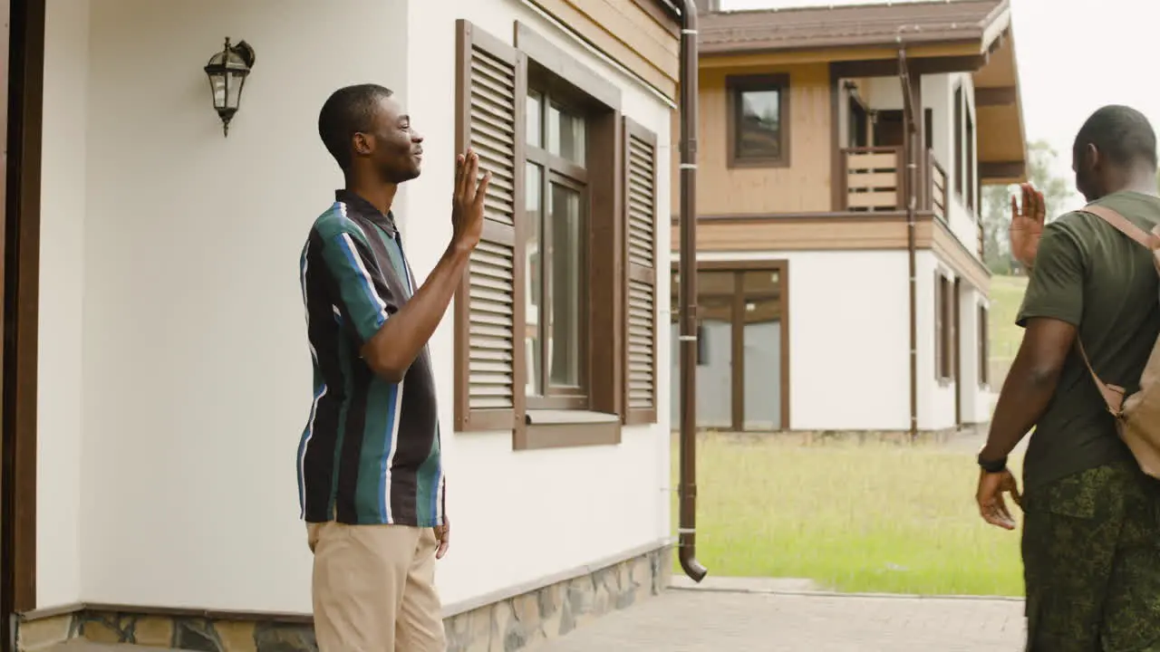 Male Soldier Hugging And Saying Goodbye To His Son Outside Home Before Going To Military Service 1