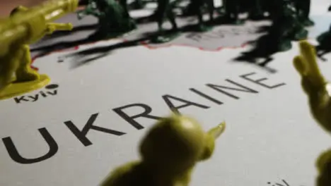 Tracking Shot Over Toy Soldiers On Map of Ukraine 01