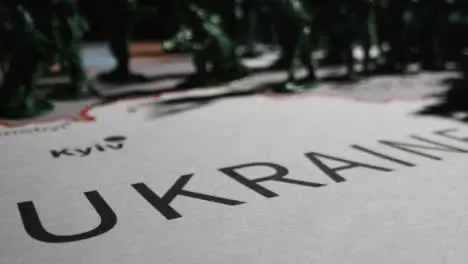 Tracking Shot Over Toy Soldiers On Map of Ukraine 05