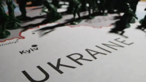 Tracking Shot Over Toy Soldiers On Map of Ukraine 04