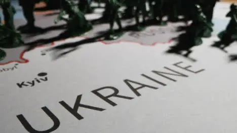 Tracking Shot Over Toy Soldiers On Map of Ukraine 03