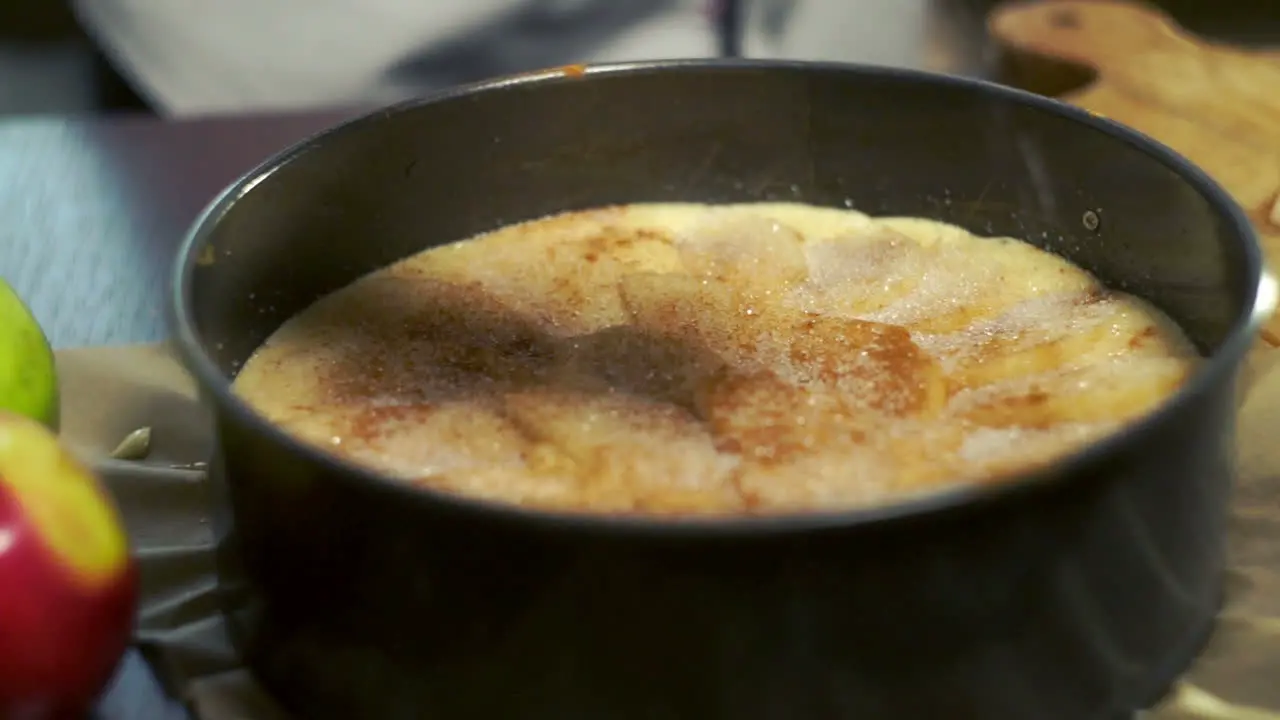 Spreading sugar on apple pie Sweet food preparation Making dessert