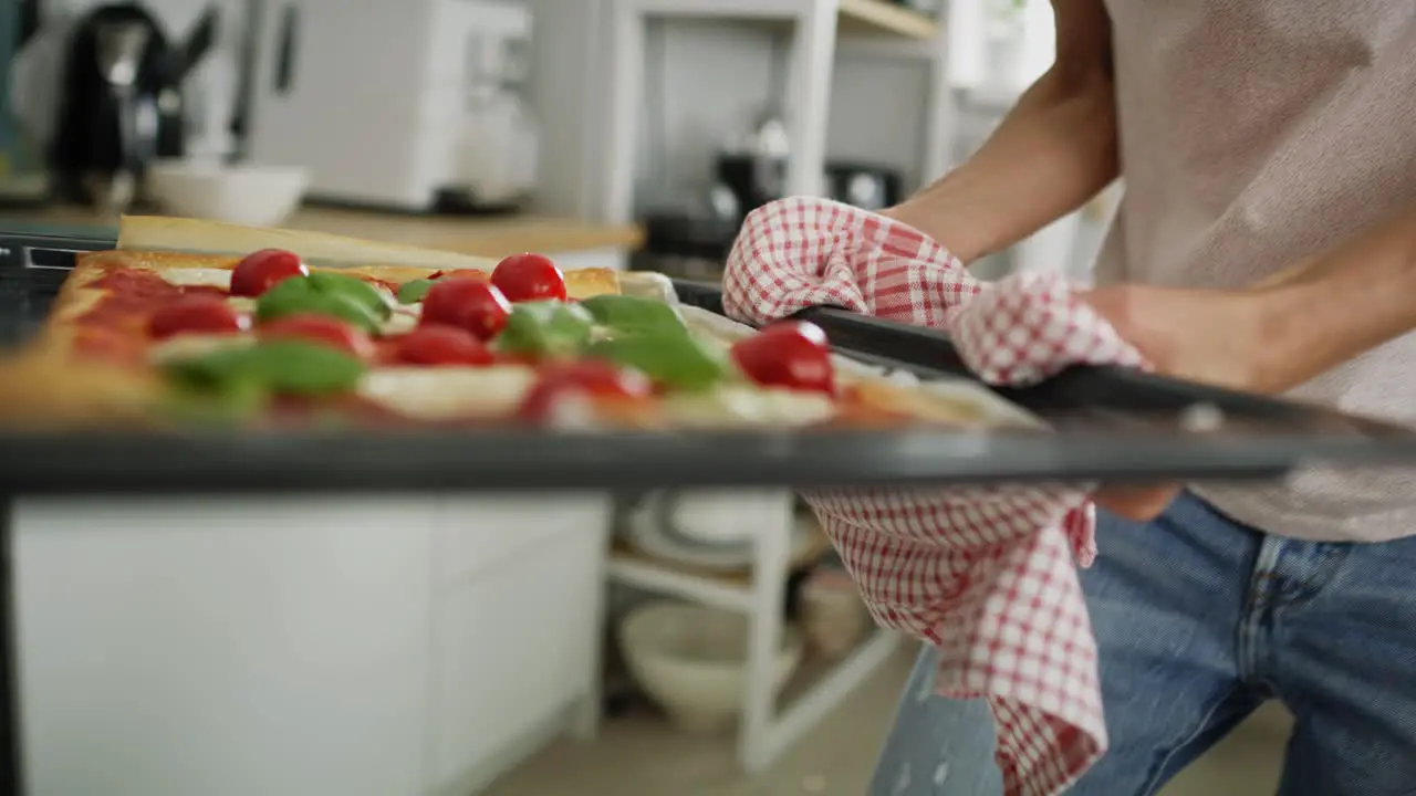 Video of pulling a homemade pizza out of the oven