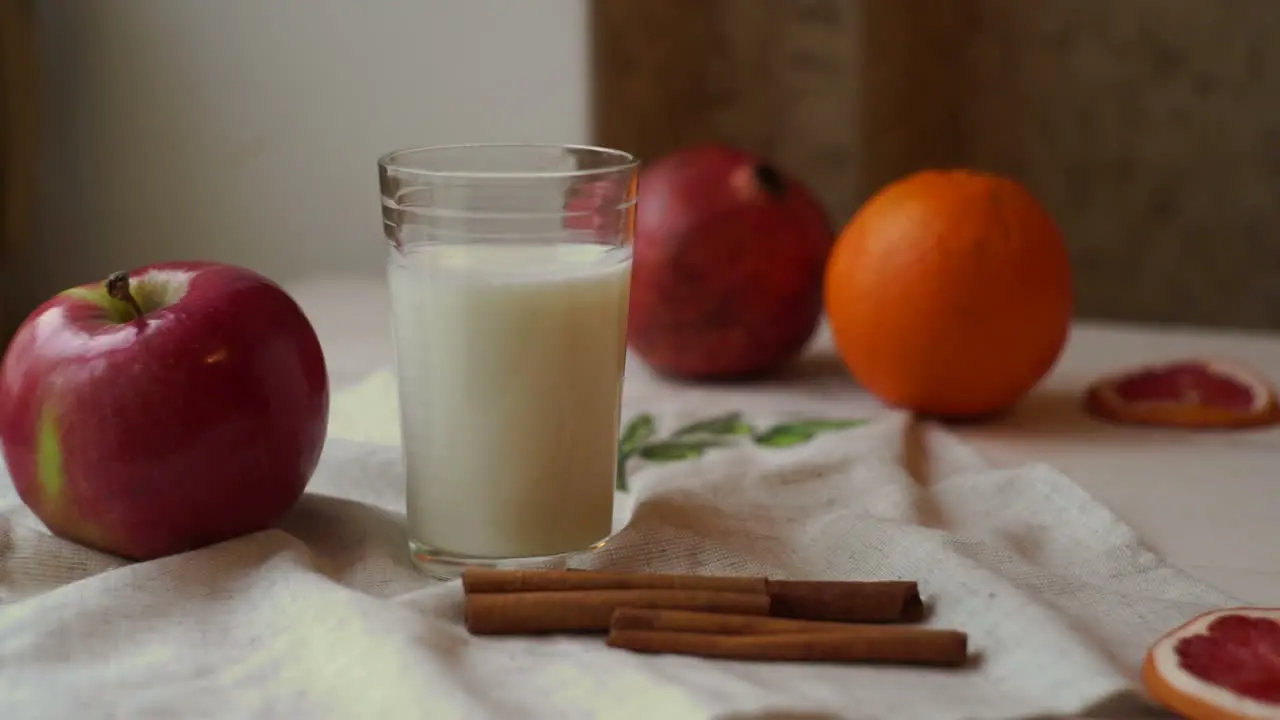 Fruits and milk glass on kitchen table Healthy breakfast Fresh apple