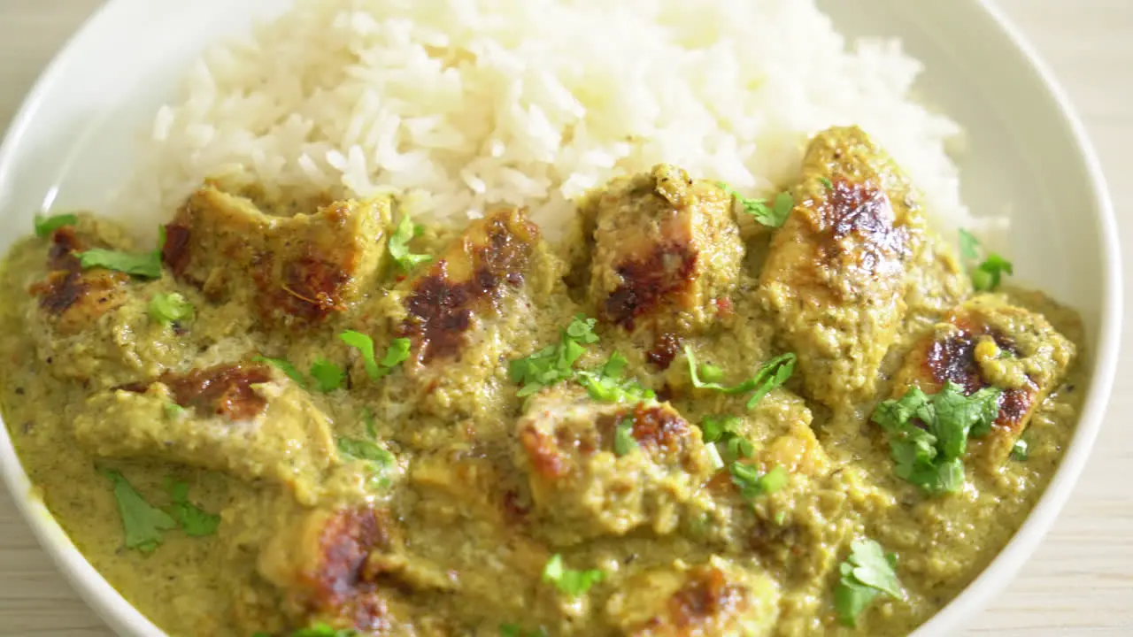 Afghani chicken in green curry or Hariyali tikka chicken hara masala with rice Asian food style