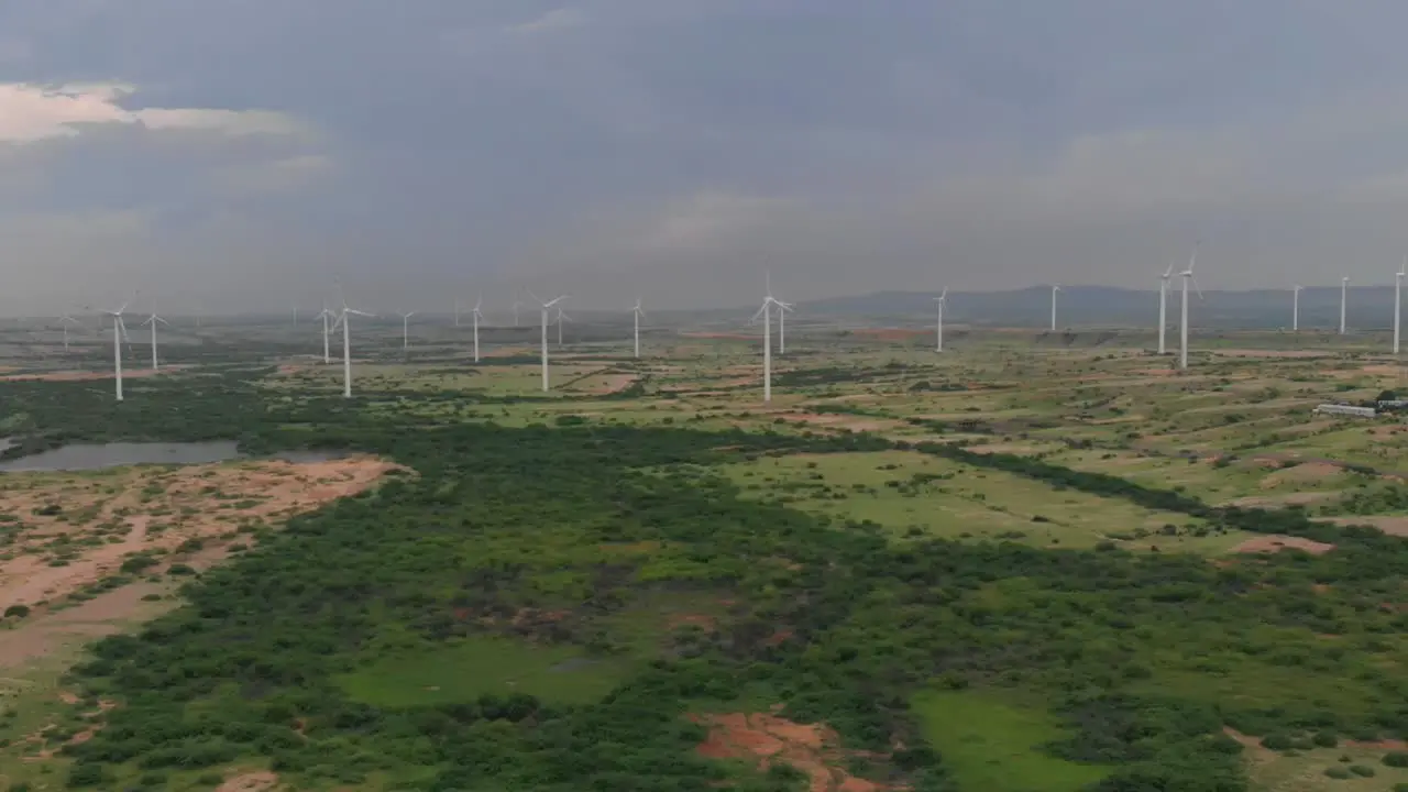 An aerial shot of wind turbines with beautiful blue sky zorlu energy wind turbines installed in Jhimpir near gharo Sindhi Pakistan