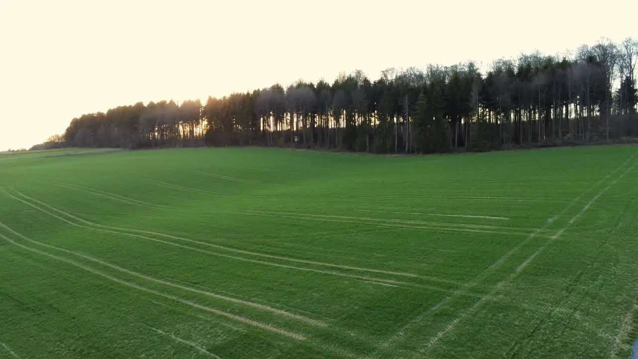 Panning from left to right over agricultural field during sunrise in Germany