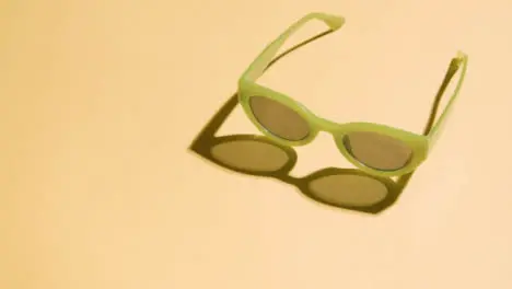 Summer Holiday Vacation Concept Of Green Sunglasses On Yellow Background 4