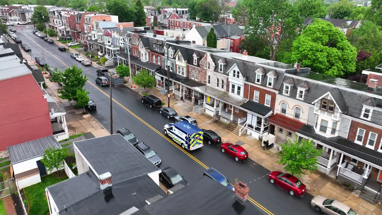 Aerial view of ambulance driving down city street