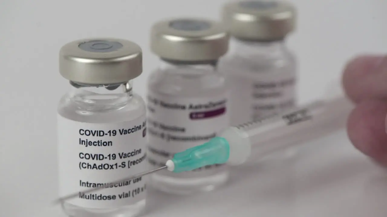 3 Covid-19 AstraZeneca vaccine vials and syringe to inject medical professionals and people at risk