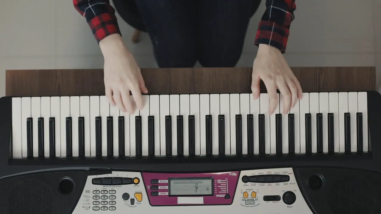 Hands Playing Electric Keyboard Close Up