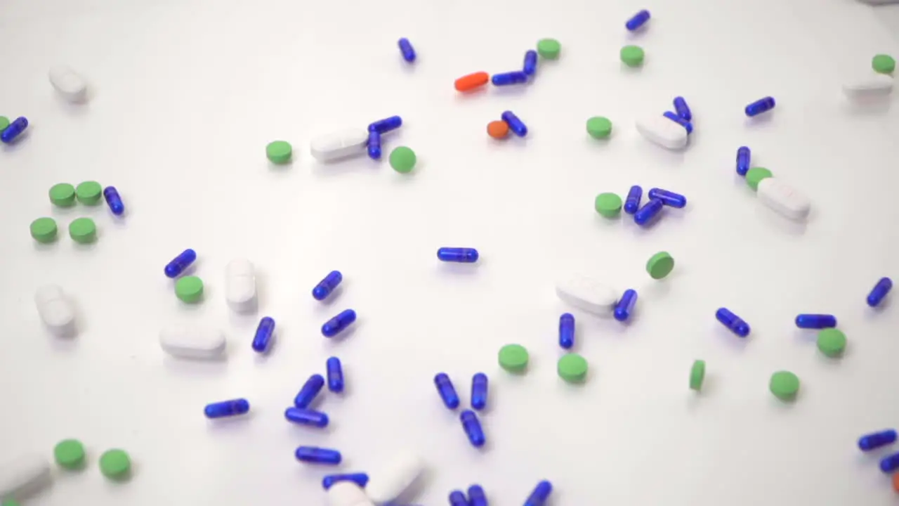 Pill Varieties Dropped onto White Background