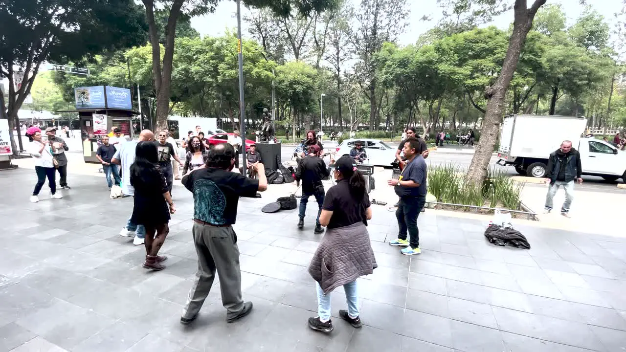 shot of people dancing in the street in Mexico city