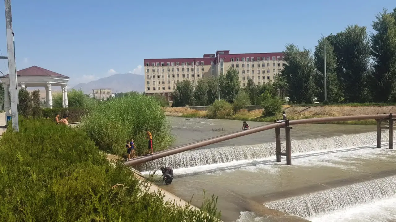 Kids Having Fun on River on Hot Summer Day Dushanbe Tajikistan