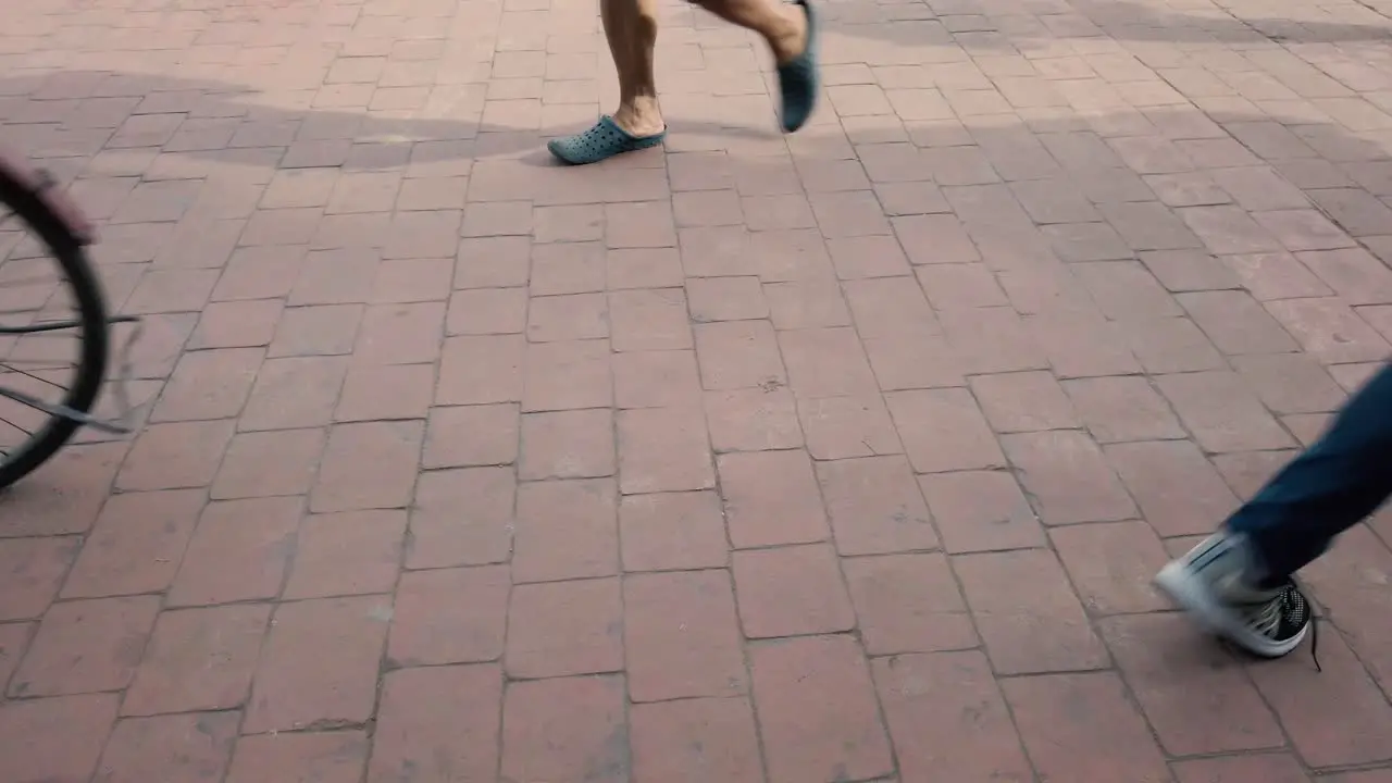 People walking crowd feet in busy public street