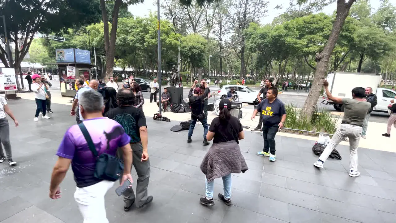 shot of people dancing in the street in downtown Mexico city