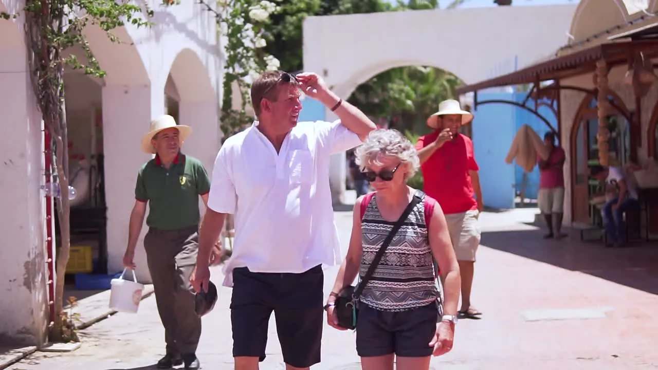 Tourist and local People walking and shopping in Djerba houmet souk