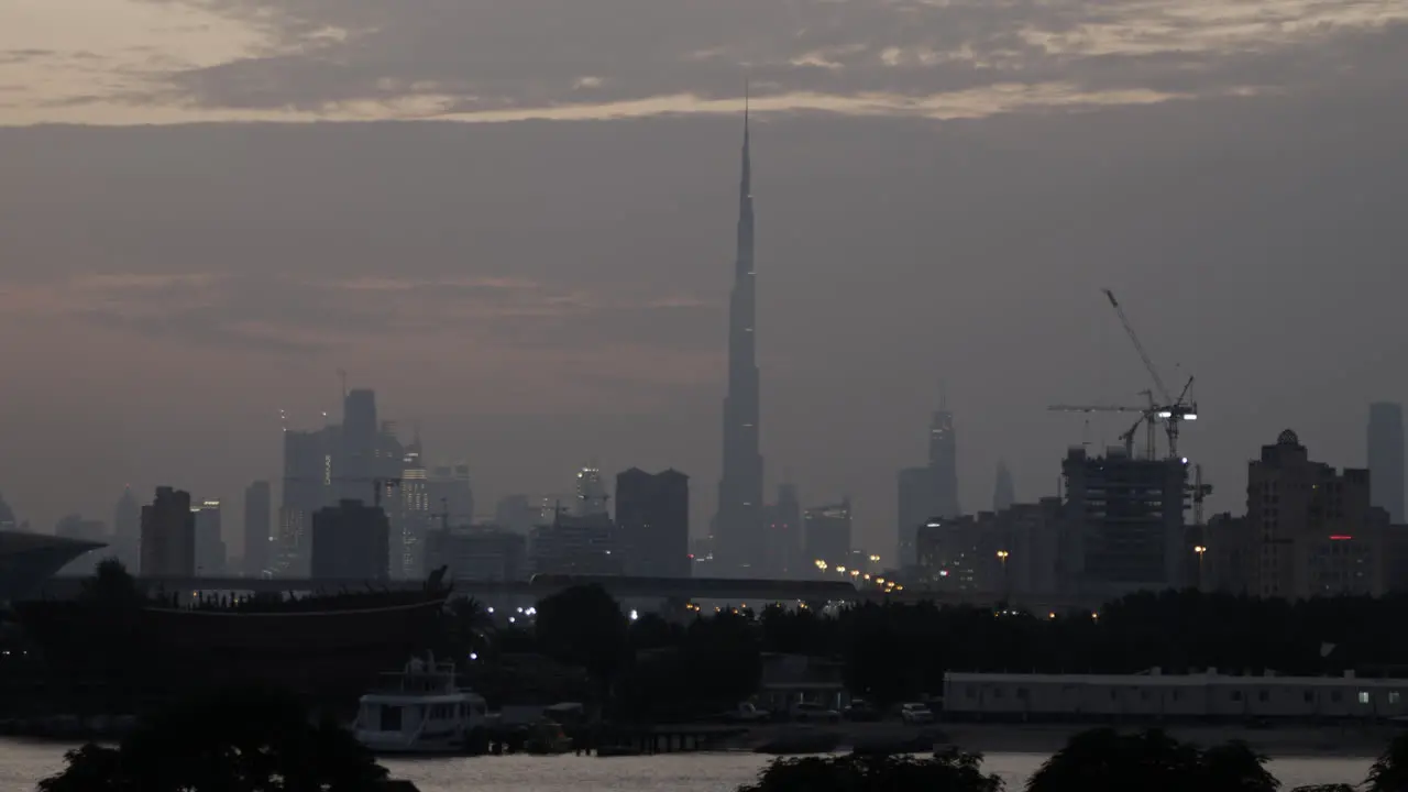 Distant Dubai skyline with Burj Khalifa at sunset