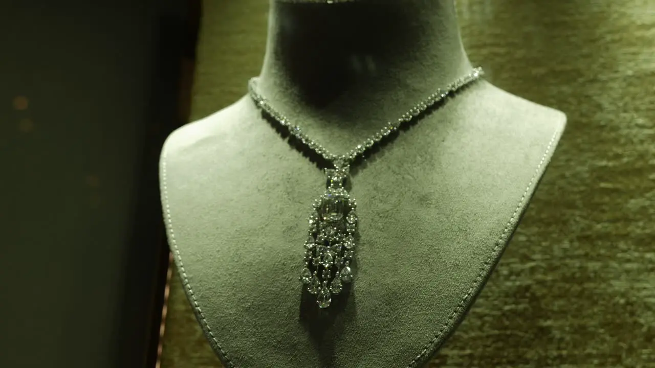 An expensive beautiful necklace displayed through a window of a jewelry shop in the middle eastern city of Dubai United Arab Emirates