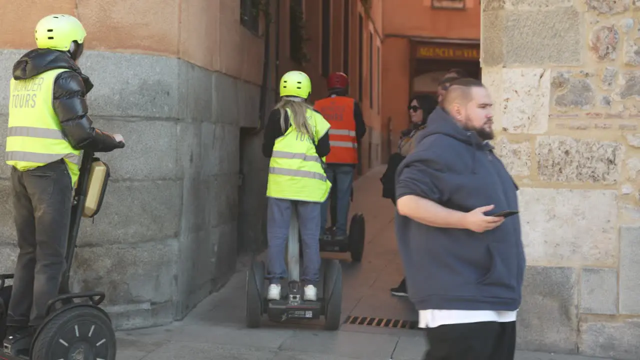 Tourists use Segway's to search the downtown narrow streets