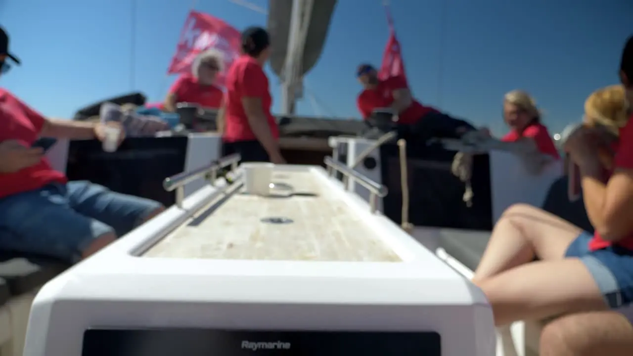 Group of people having a day off sailing in the mediterranean sea while revealing the map