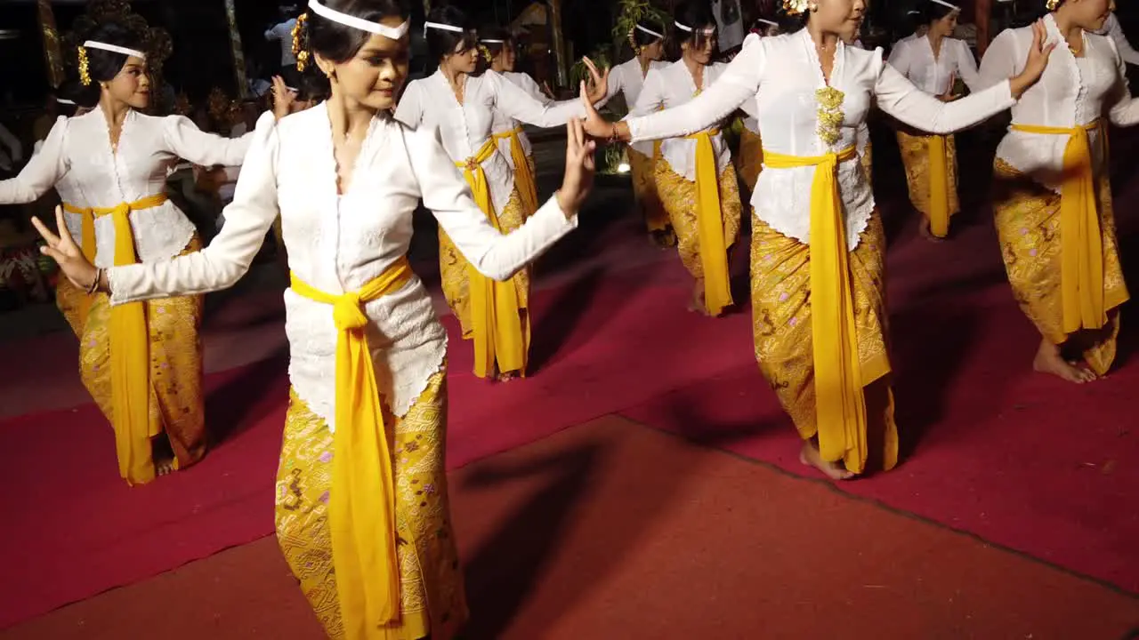 Balinese Girls Dancing at Night Temple Ceremony of Hindu Religion Cultural Meeting with Beautiful Traditional Attires