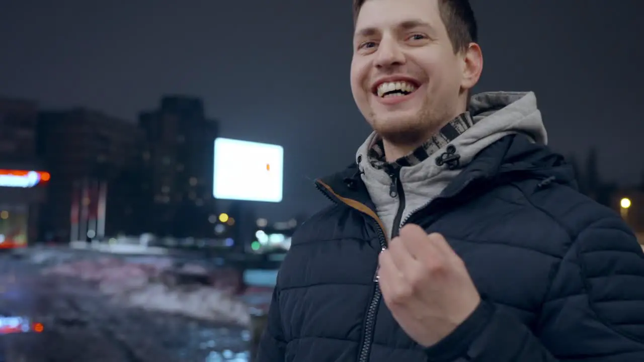 Italian man talking to the camera using hand gestures outdoors in city