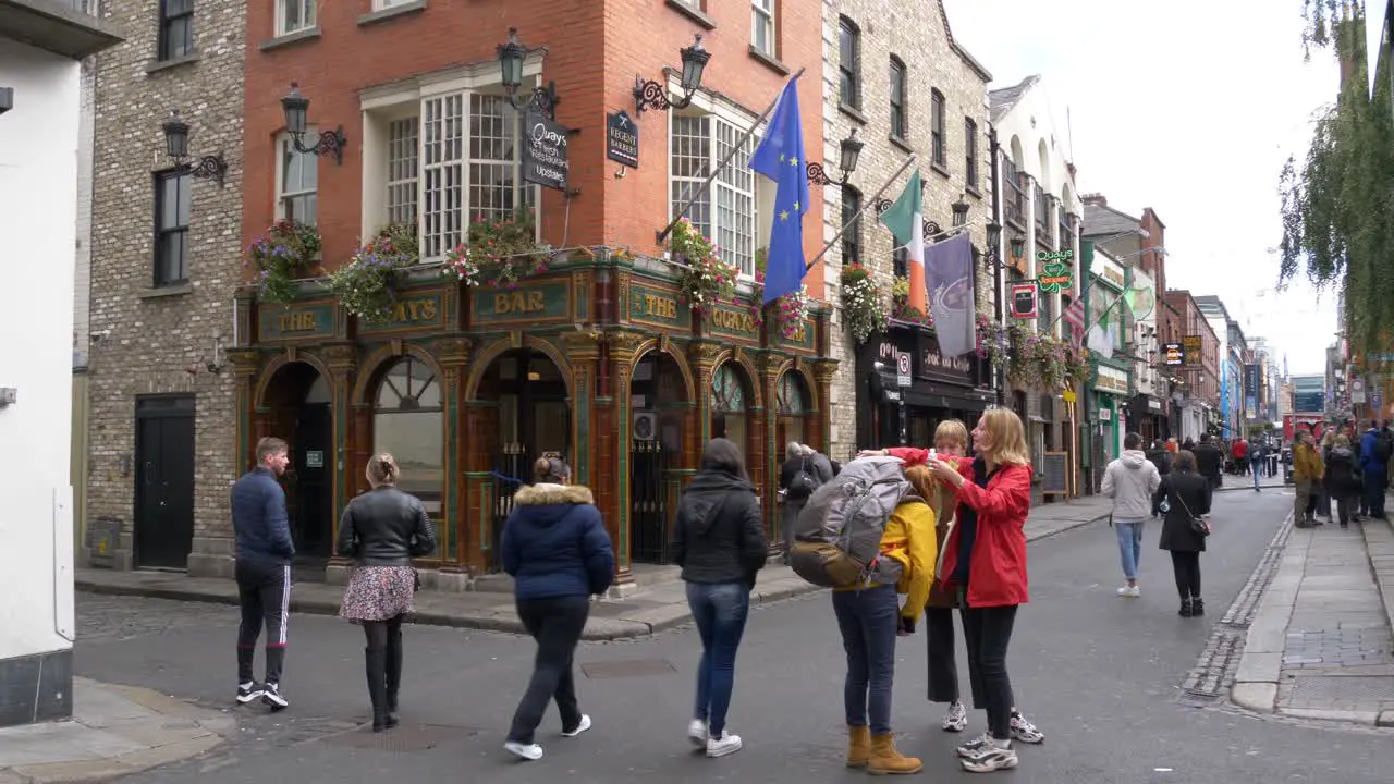 People Along The Famous Temple Bar Street For A Pint Of Guinness In Dublin City Ireland